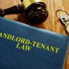 landlord tenant law book on a table