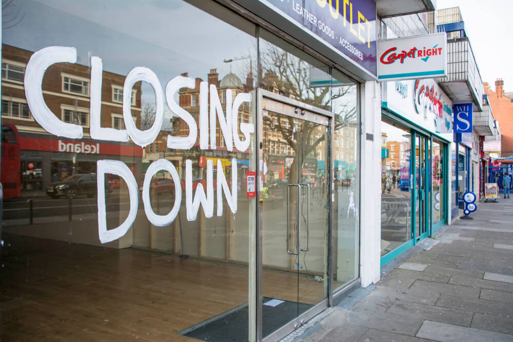commercial tenant eviction in the UK, closed sign on the shop