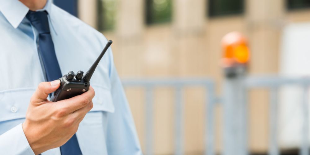 close up of a security guard with a walkie talkie