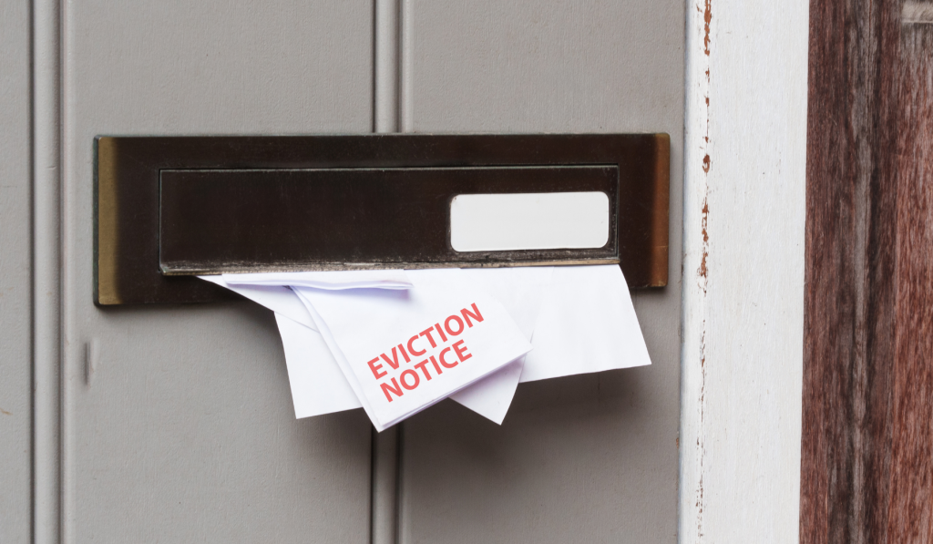 Letter reading 'Eviction notice' in bold red letters in a letter box